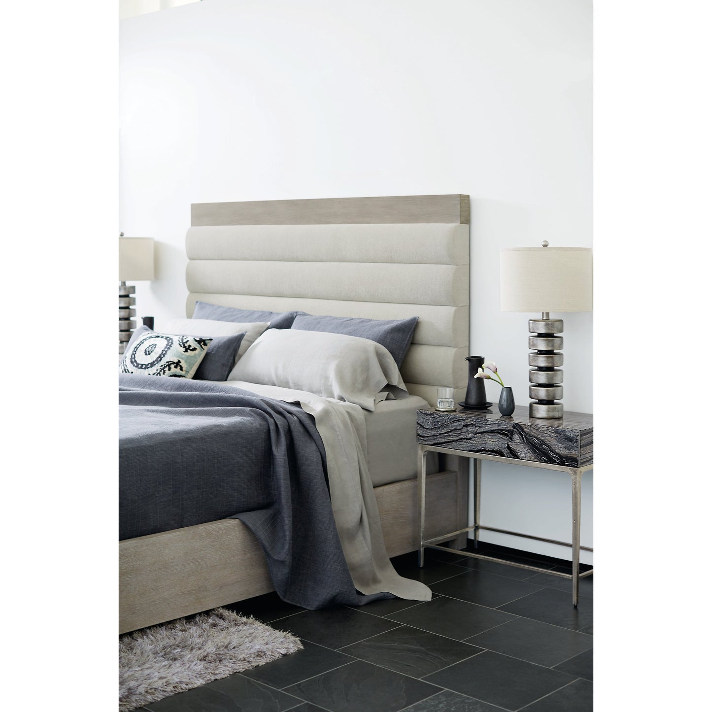 006 SI-1711418,SI-1711419 | Lifestyle | Linea Upholstered Channel Bed by Bernhardt in cerused greige. Made from white oak veneers, fabric in a unique style.