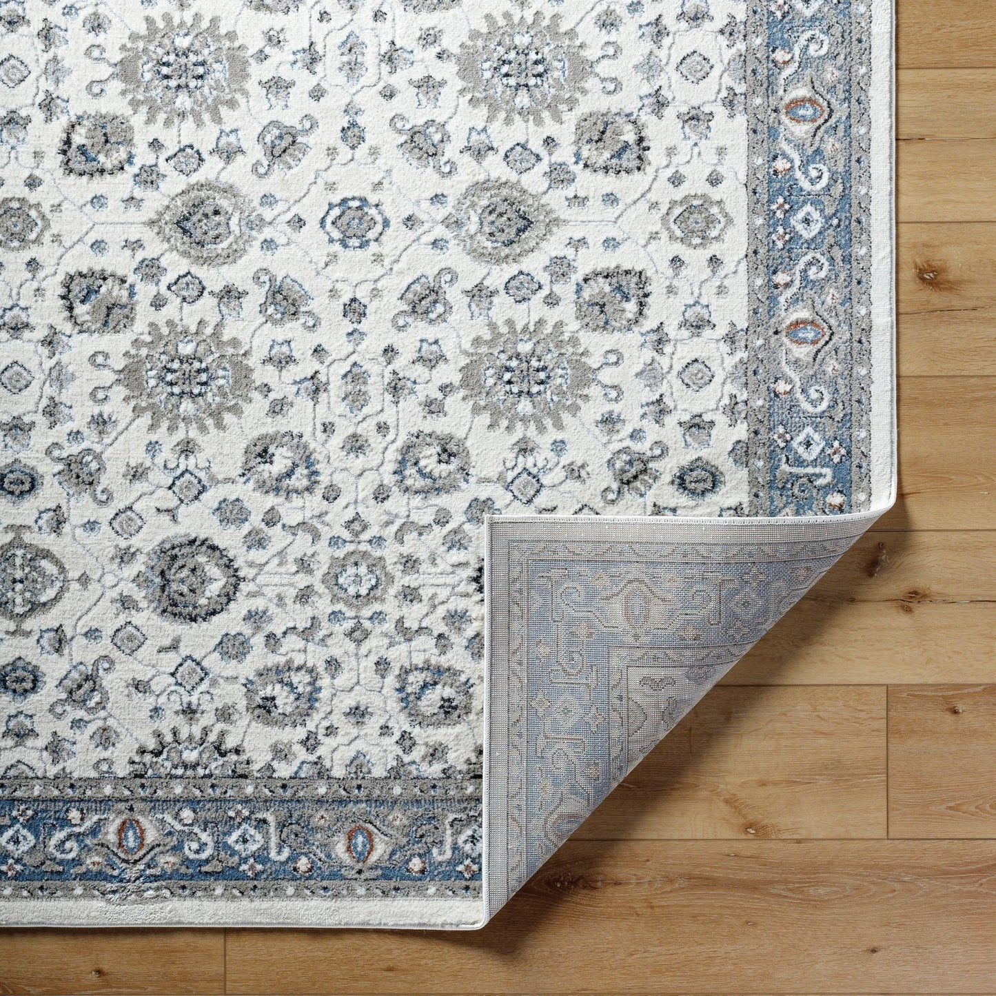 004 SI-2167753,SI-2167754 | Closeup | Zidane Rug - 494508 by Livabliss in white, dark brown, blue, black, olive, rust. Made from polyester in a unique style.