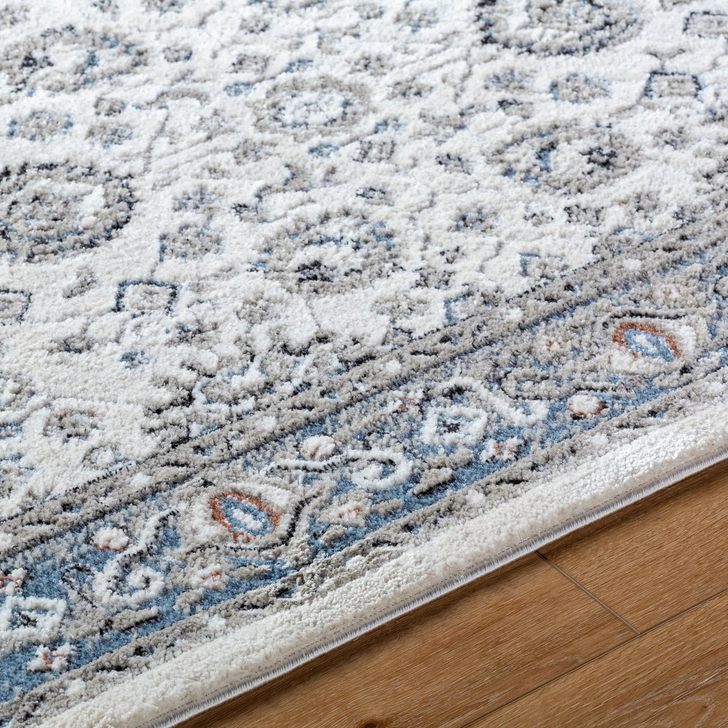 005 SI-2167753,SI-2167754 | Closeup | Zidane Rug - 494508 by Livabliss in white, dark brown, blue, black, olive, rust. Made from polyester in a unique style.