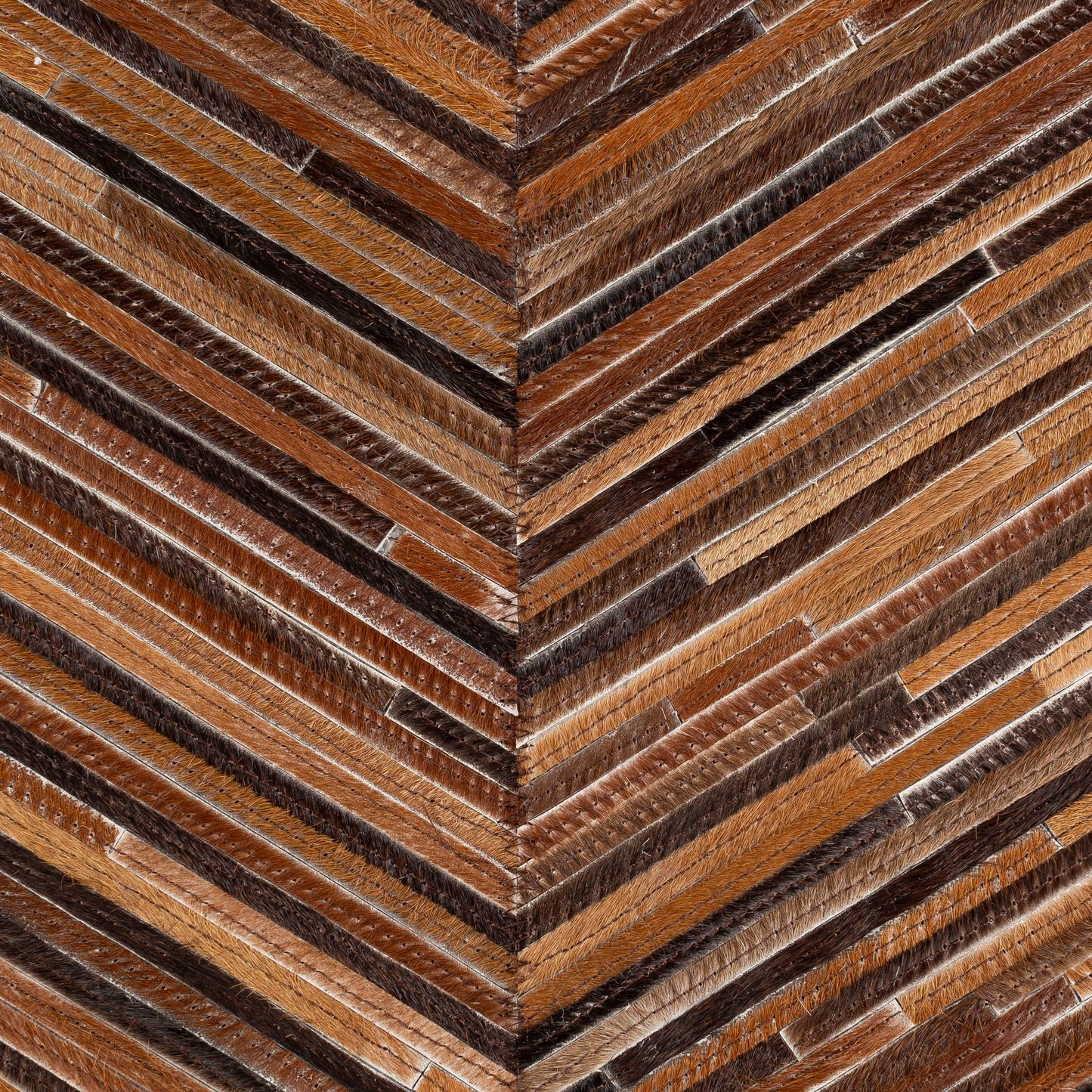 003 SI-1893911,SI-1893912 | Closeup | Zander Pillow - 33183 by Surya in caramel, dark brown, black, medium brown. Made from 100% hair on hide, 80% polyester, 20% cotton in a transitional style.