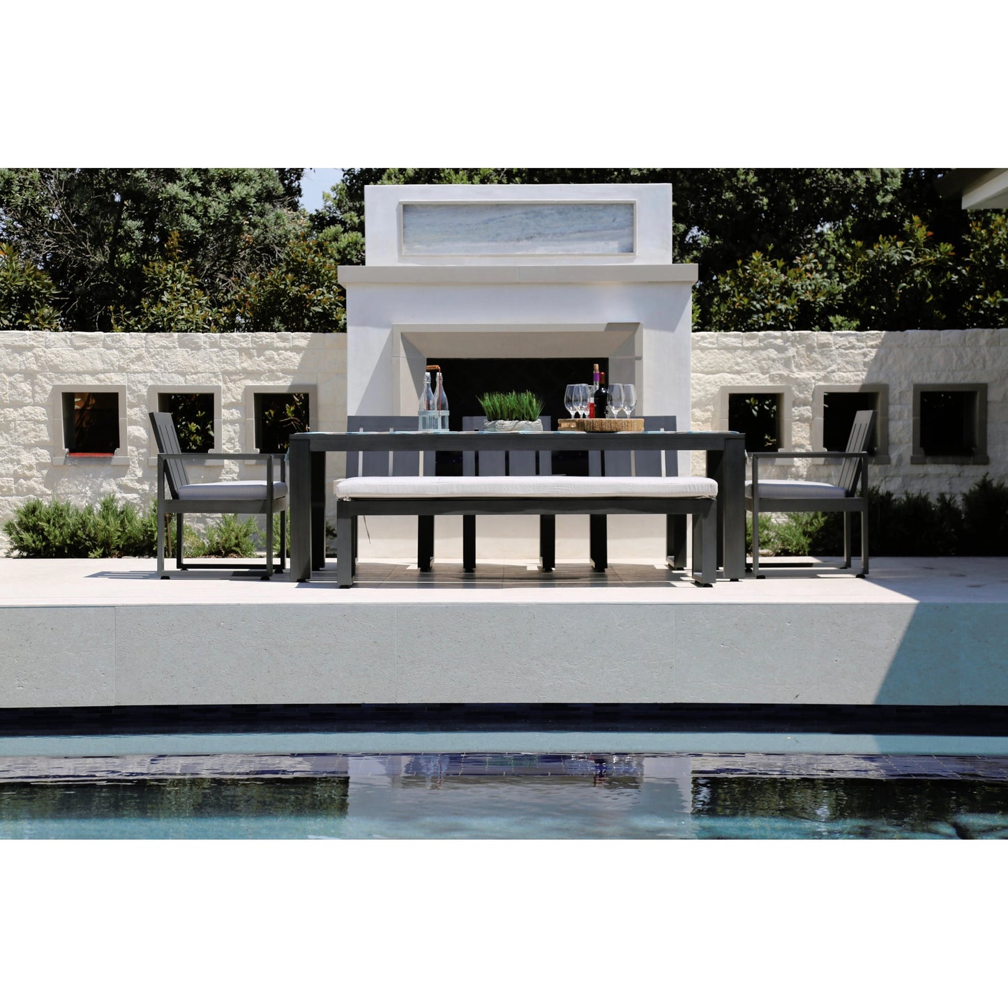 003 SI-2166980 | Lifestyle | Redondo Outdoor Dining Bench by Sunset West in slate. Made from aluminum in a modern style.