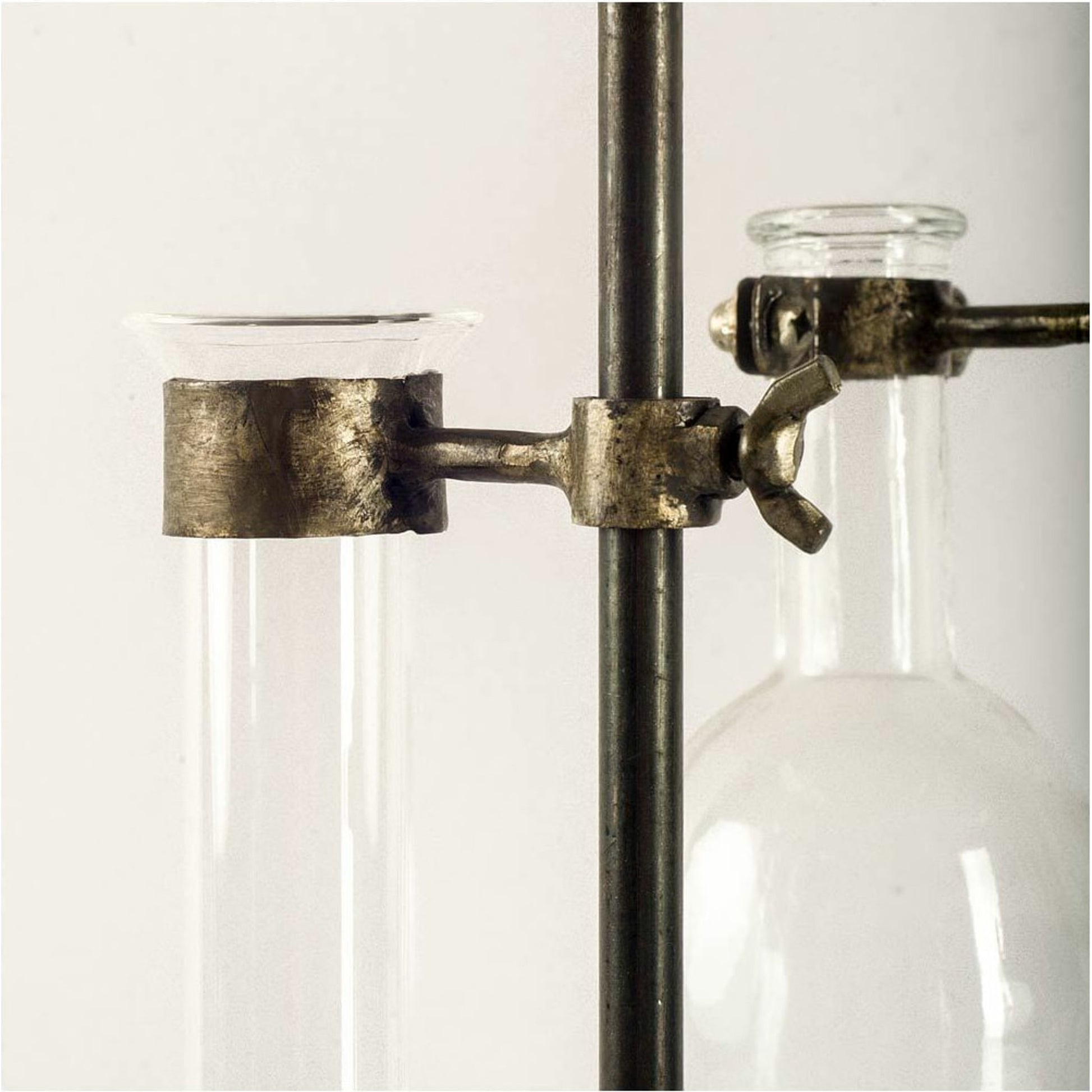 Jarvis Dark Glass Chemistry Inspired Bottles Set of Five by Mercana in dark brown metal. Made from unique in a modern style.