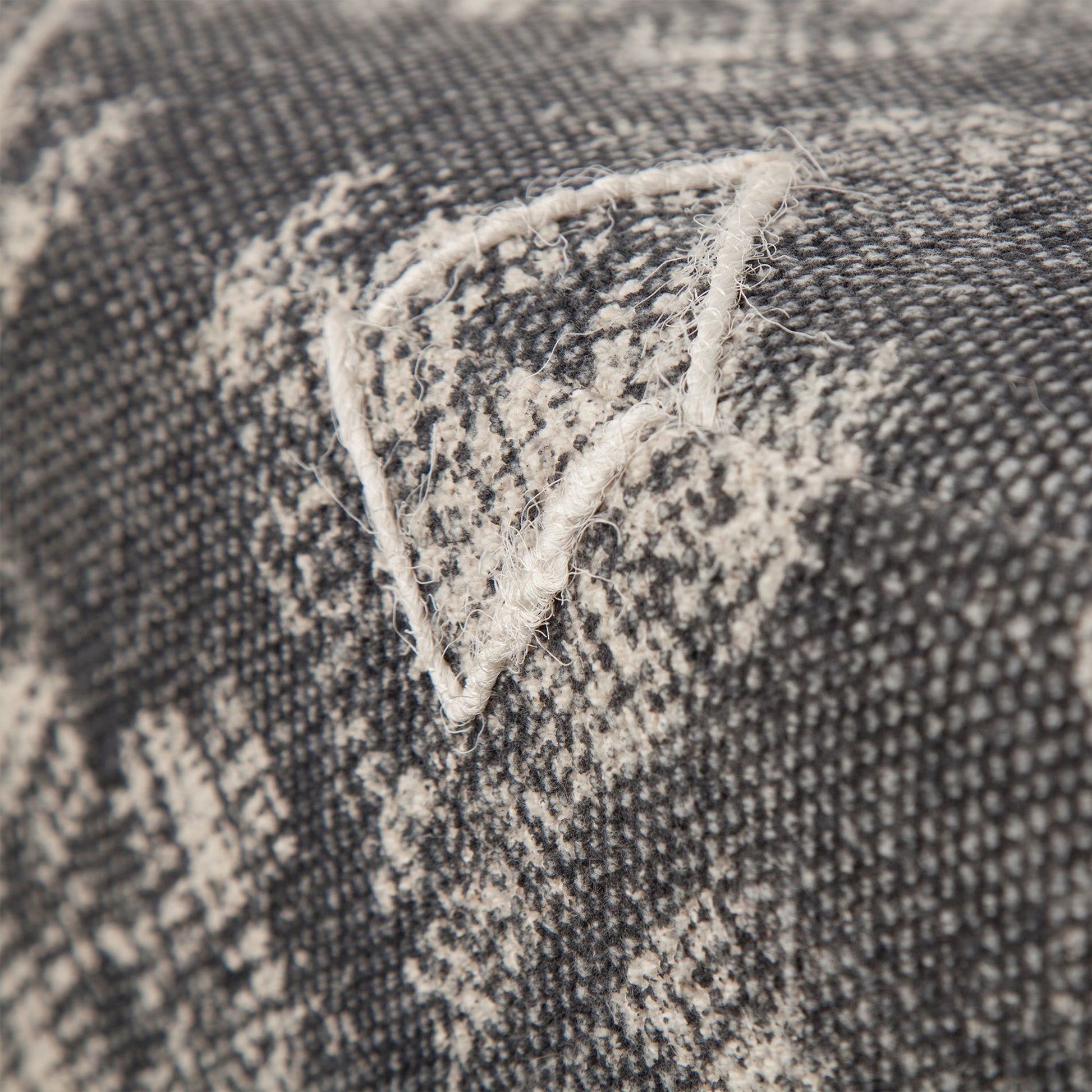 Pallu Ottoman by Mercana in black. Made from dhurrie cotton in a eclectic & global style.