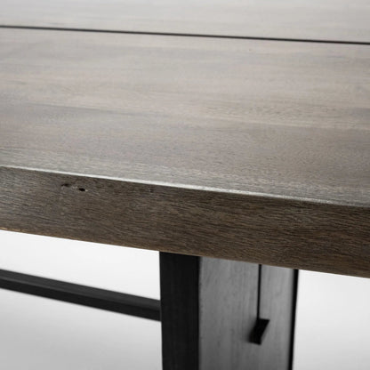Ledger Dining Table by Mercana in brown. Made from wood in a modern style.