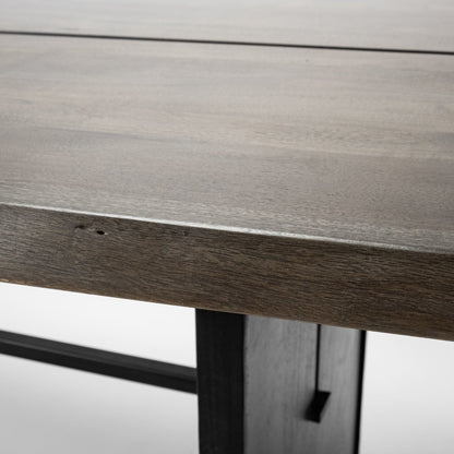 Ledger Dining Table by Mercana in brown. Made from wood in a modern style.