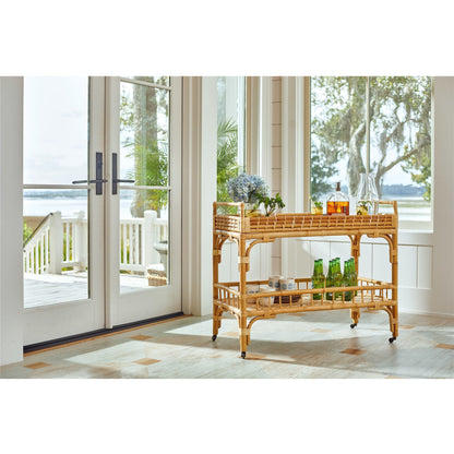 5 O'Clock Bar Cart by Coastal Living by Universal Furniture in antique brass and natural rattan. Made from unique in a coastal style.