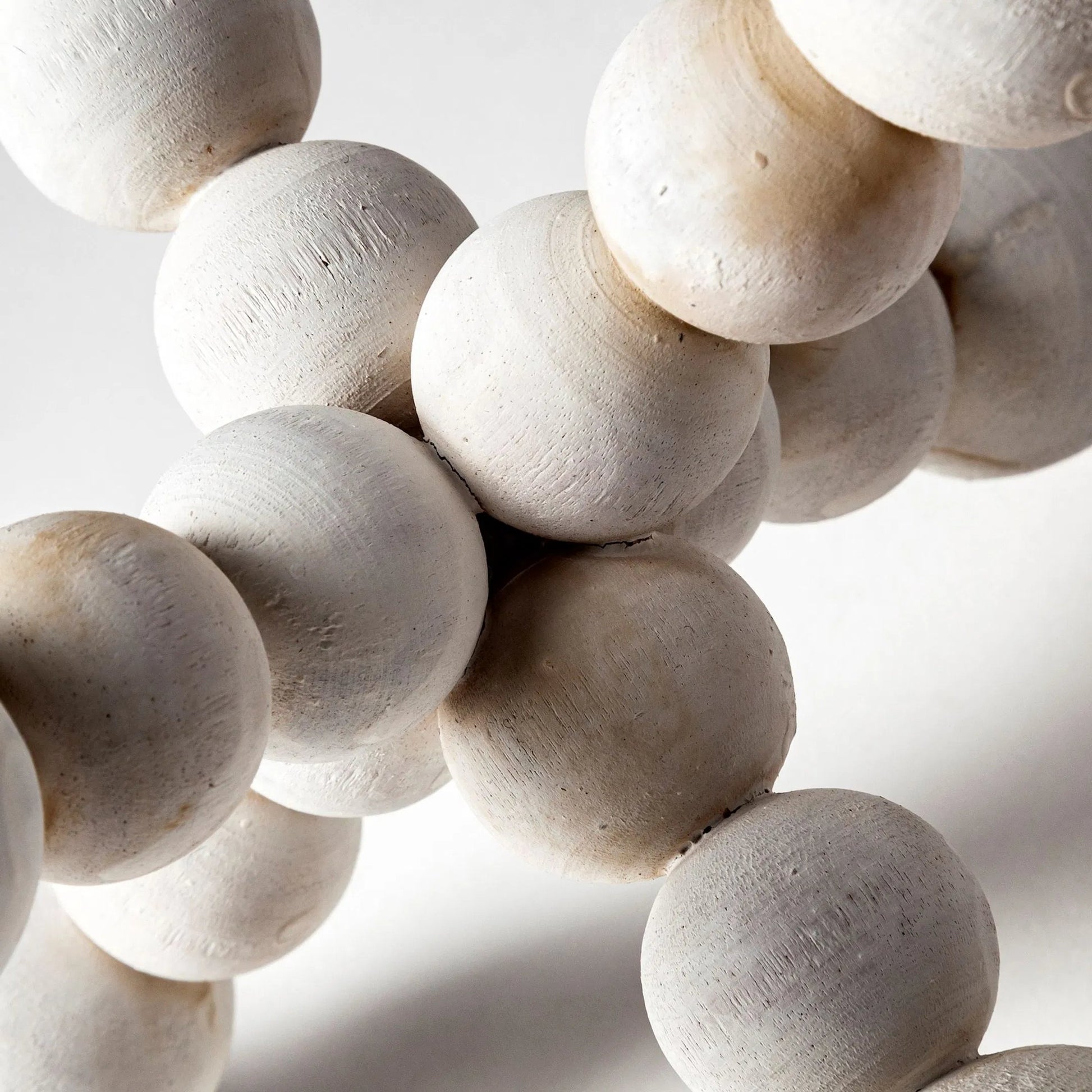 Carrollton I Off- Geometric Wood Ball Jack by Mercana in white wash. Made from unique in a eclectic & global style.