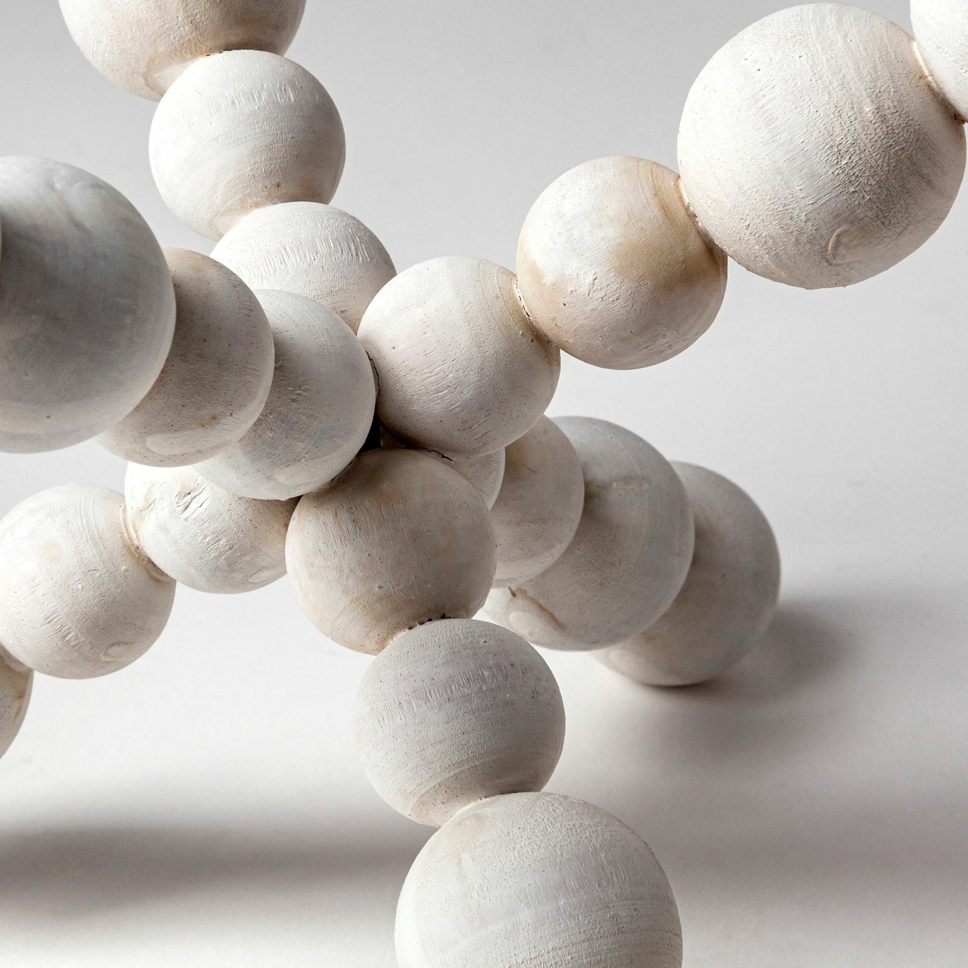 Carrollton I Off- Geometric Wood Ball Jack by Mercana in white wash. Made from unique in a eclectic & global style.