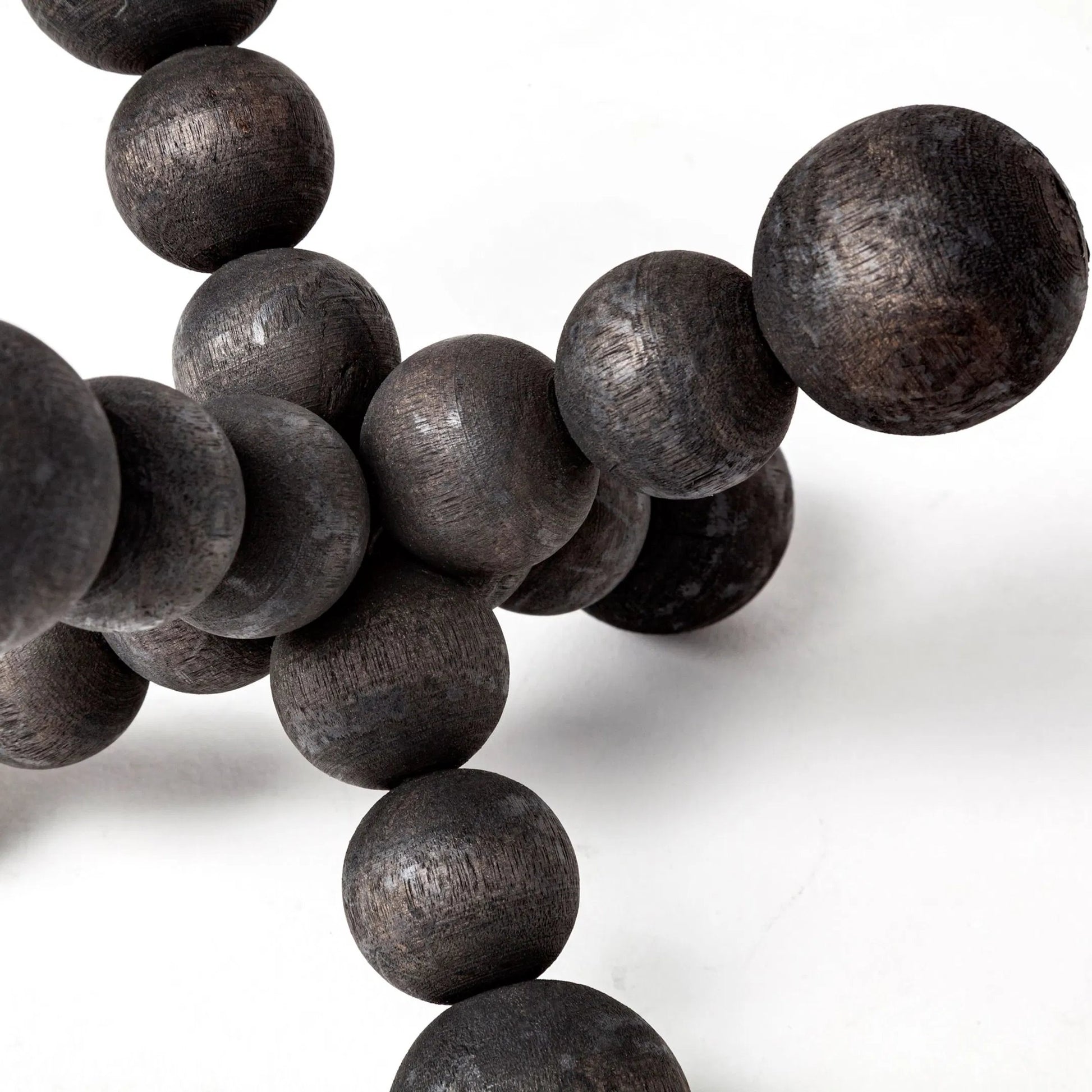 Carollan I Geometric Wood Ball Jack by Mercana in rustic black. Made from unique in a modern style.