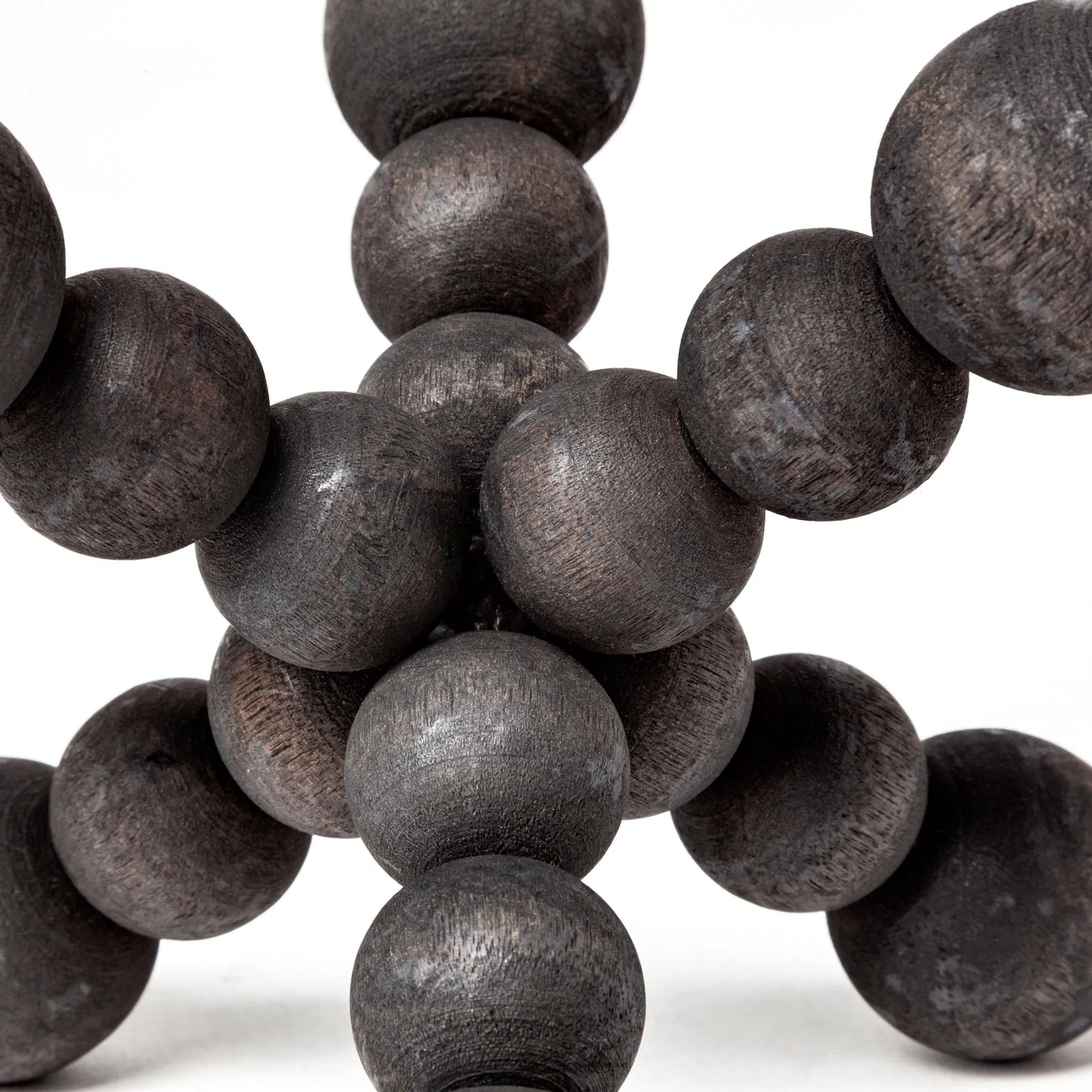 Carollan I Geometric Wood Ball Jack by Mercana in rustic black. Made from unique in a modern style.