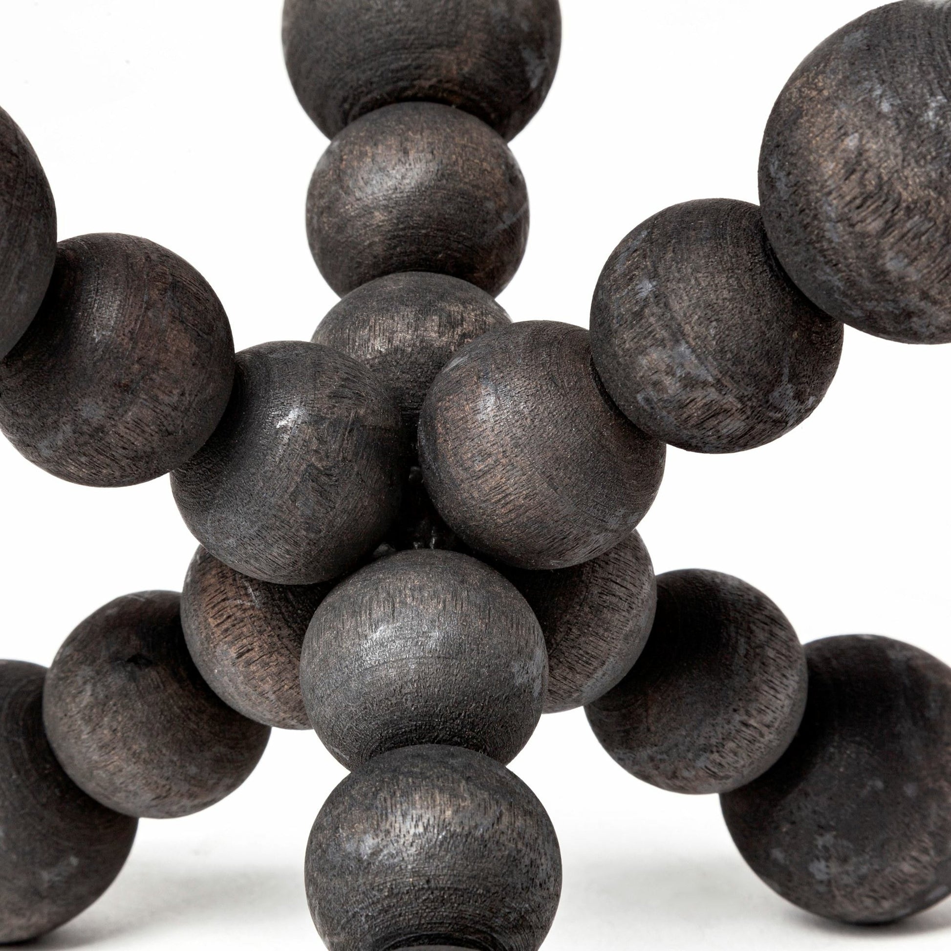 Carollan I Geometric Wood Ball Jack by Mercana in rustic black. Made from unique in a modern style.