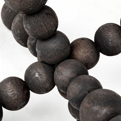 Carollan I Geometric Wood Ball Jack by Mercana in rustic black. Made from unique in a modern style.