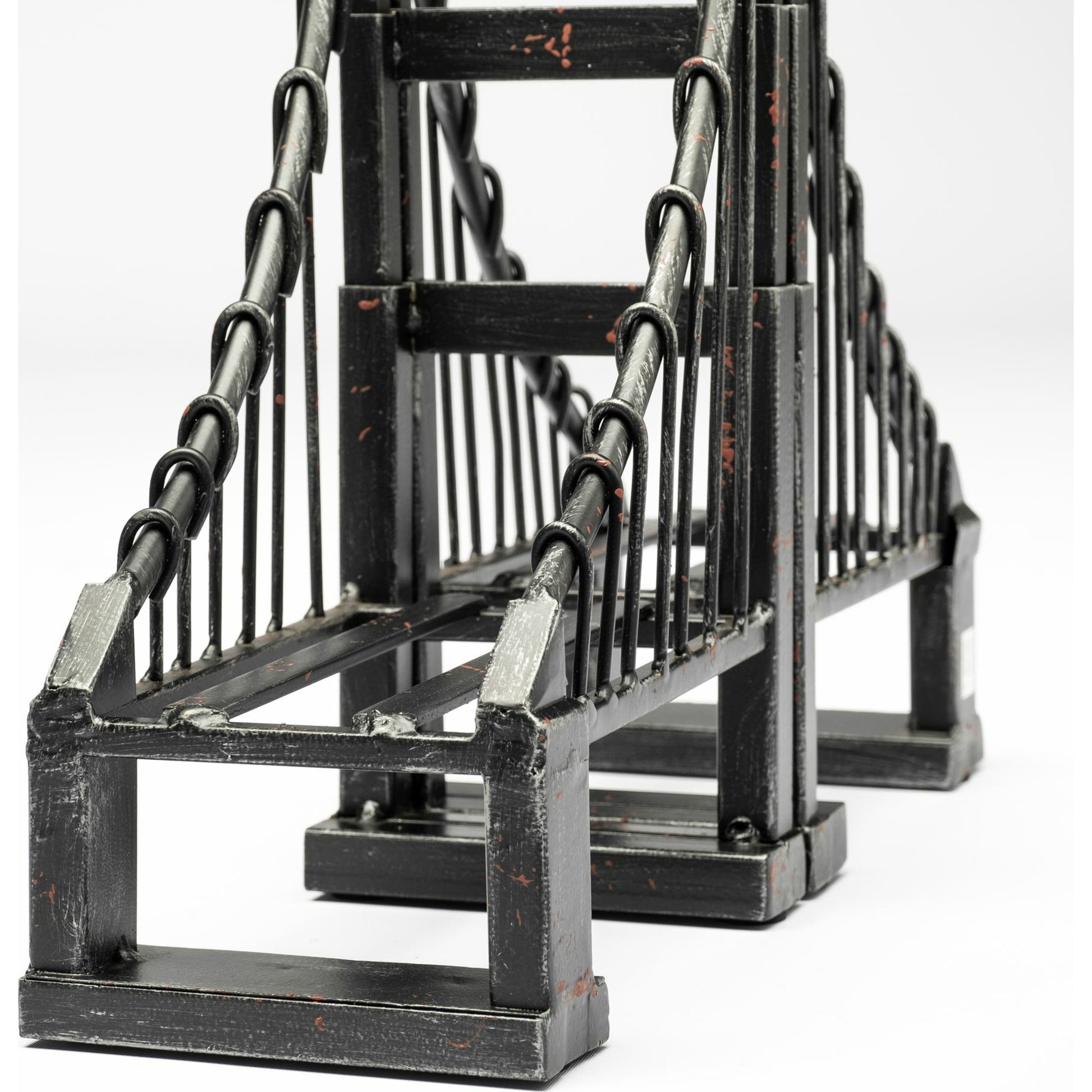 Suspension Wrought Iron Suspension Bridge Bookends Set of Two by Mercana in brown. Made from unique in a traditional style.