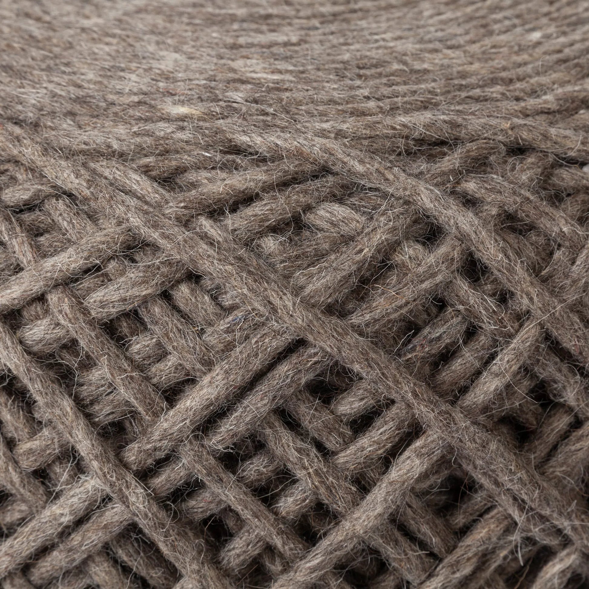 Allium Pouf by Mercana. Made from handwoven wool in a eclectic & global style.