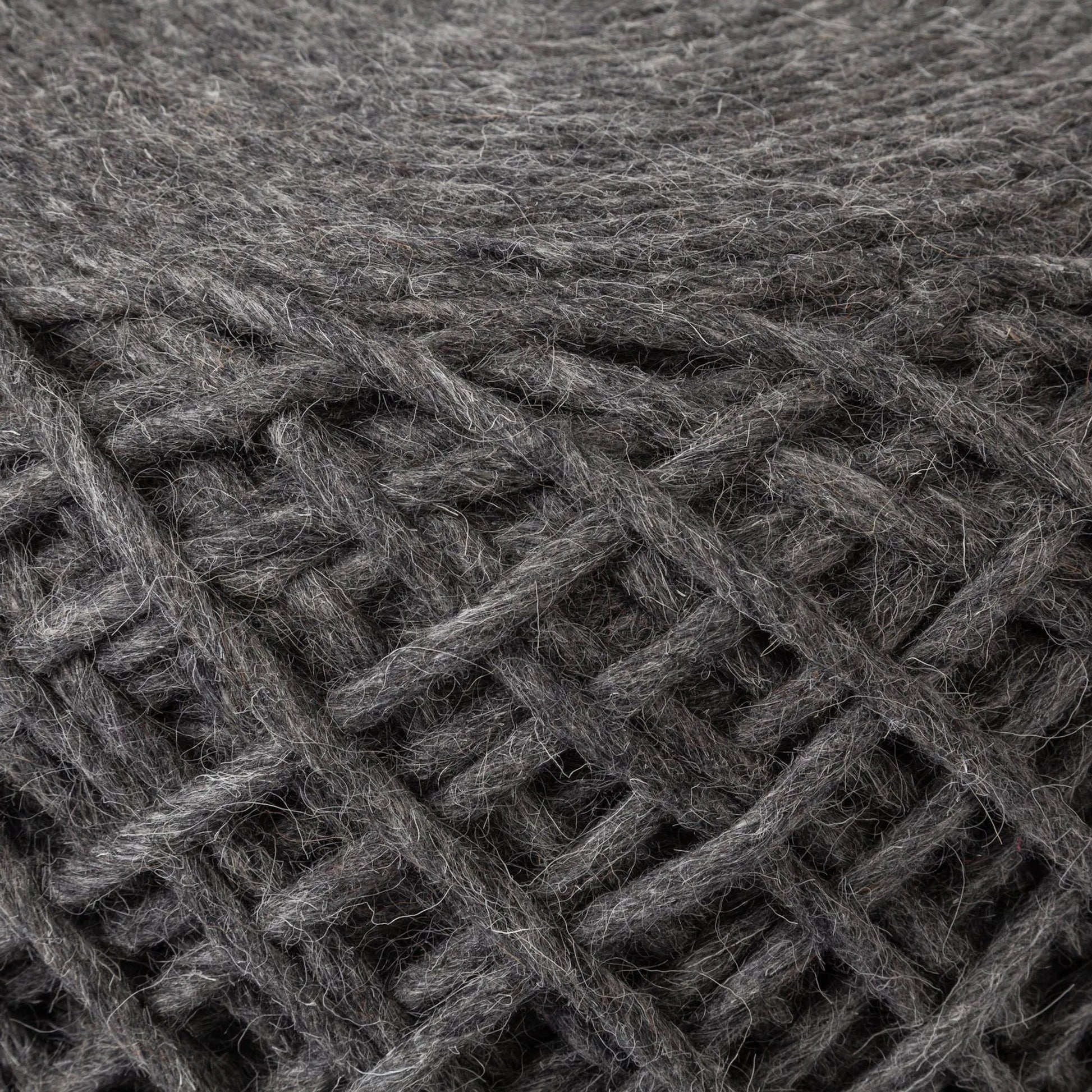 Allium Pouf by Mercana. Made from handwoven wool in a eclectic & global style.