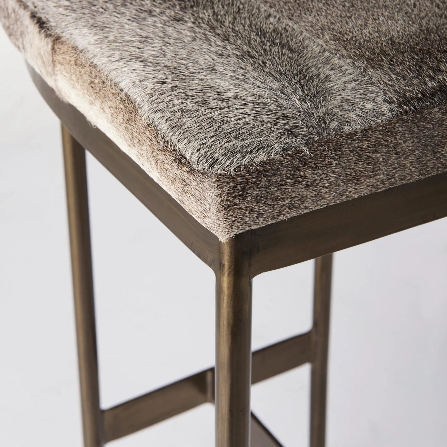 105 SI-1718034 | Closeup | Millie Hide Seat Bar/Counter Stool by Mercana. Made from metal in a modern style.