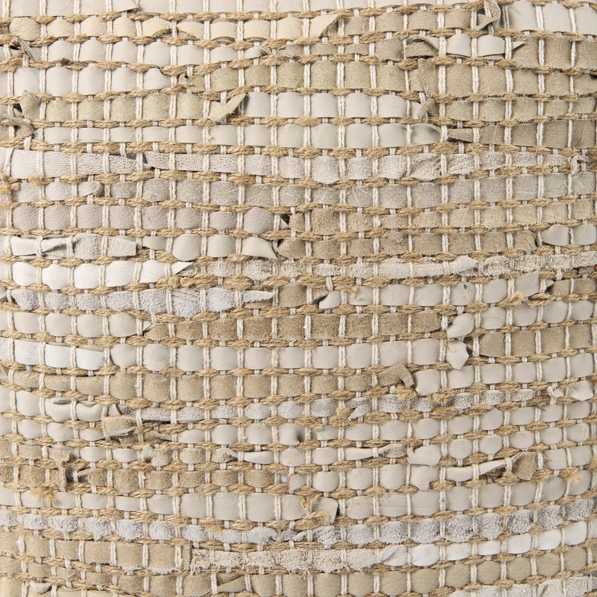 Aalia Pouf by Mercana. Made from leather in a rustic style.