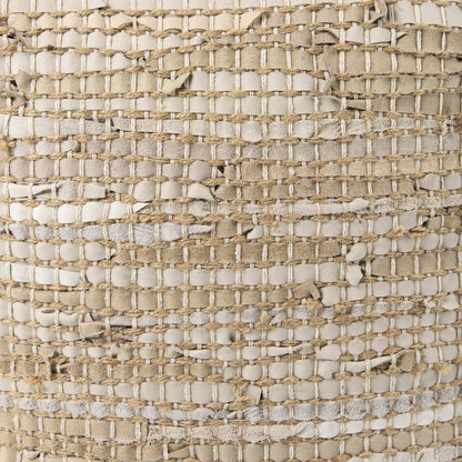 Aalia Pouf by Mercana. Made from leather in a rustic style.
