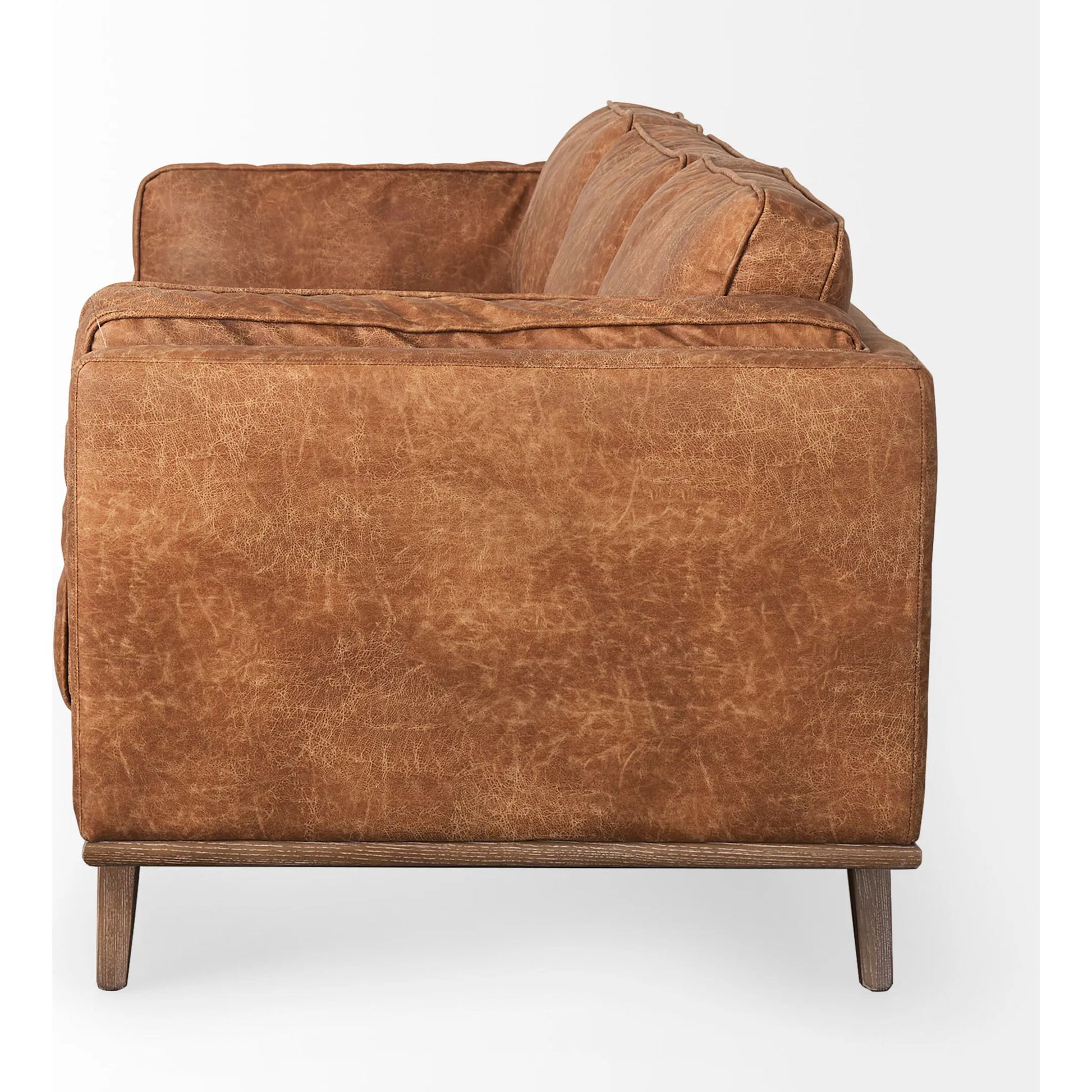 Brooks Leather Sofa by Mercana in cognac. Made from faux leather in a traditional style.