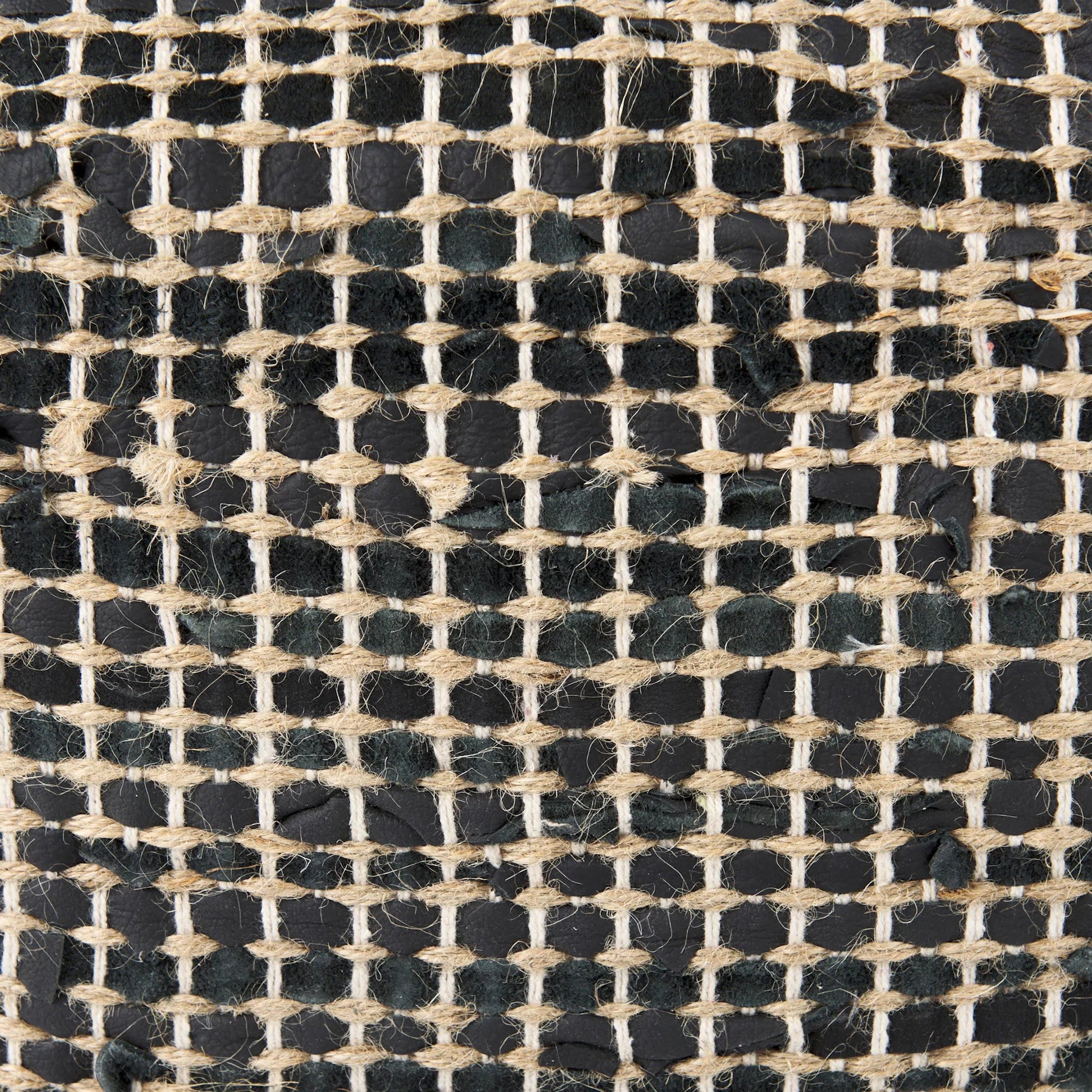 Aalia Pouf by Mercana. Made from leather in a rustic style.