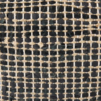 Aalia Pouf by Mercana. Made from leather in a rustic style.