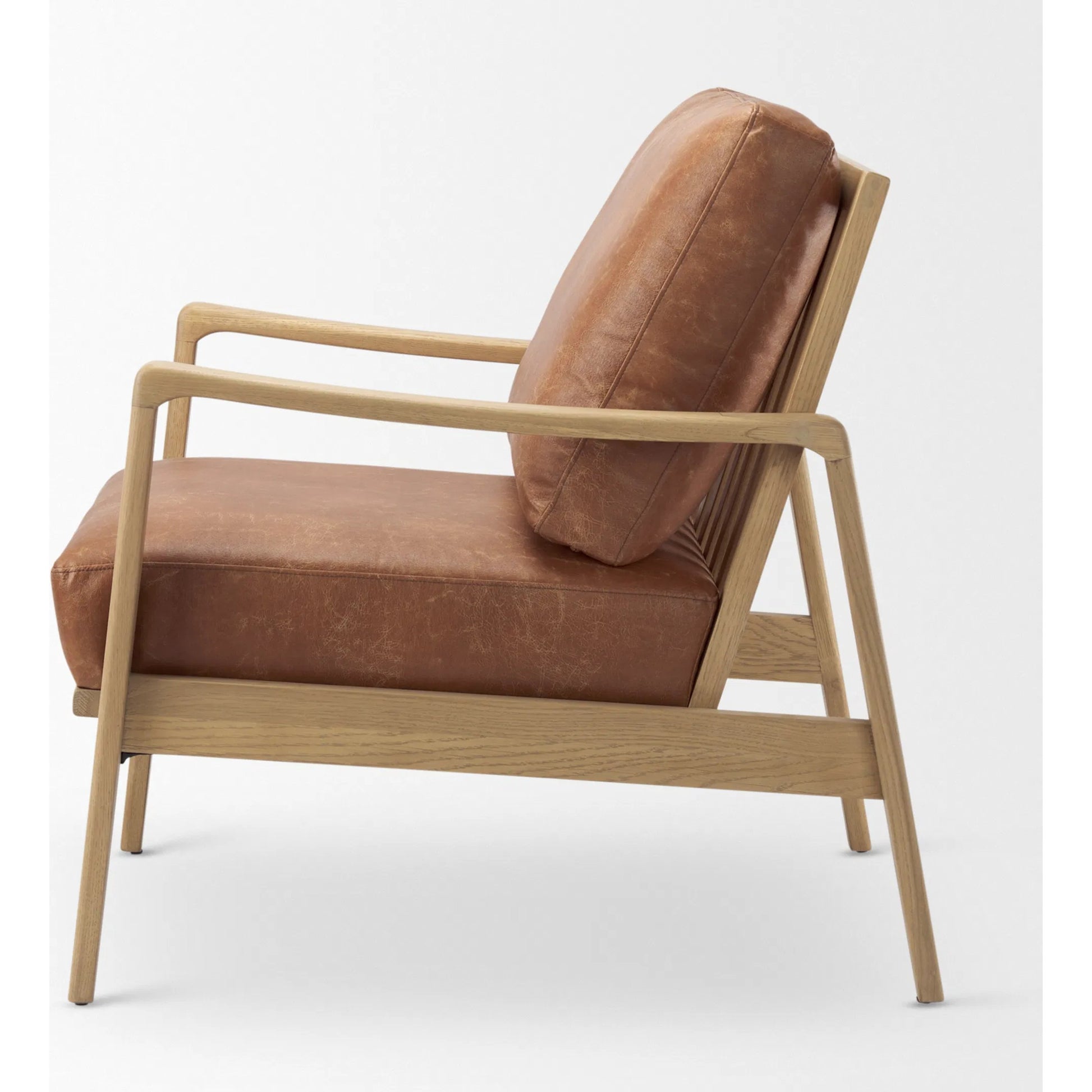 Raeleigh Leather Accent Chair by Mercana in tan. Made from fabric in a traditional style.