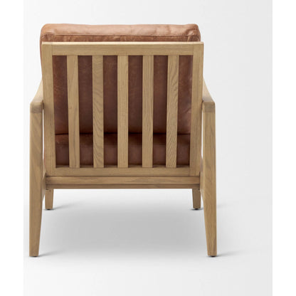 Raeleigh Leather Accent Chair by Mercana in tan. Made from fabric in a traditional style.