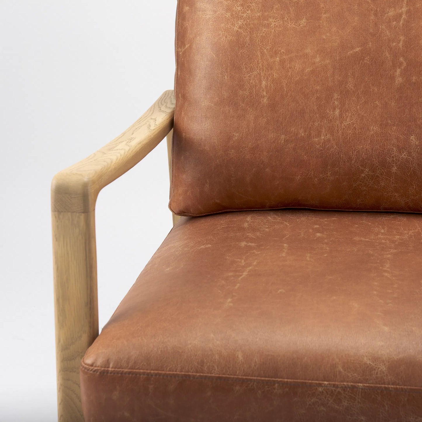 030 SI-2369942 | Closeup | Raeleigh Leather Accent Chair by Mercana in tan. Made from fabric in a traditional style.