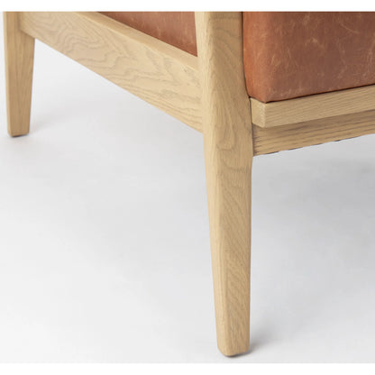 Raeleigh Leather Accent Chair by Mercana in tan. Made from fabric in a traditional style.