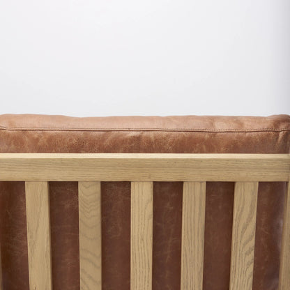 Raeleigh Leather Accent Chair by Mercana in tan. Made from fabric in a traditional style.