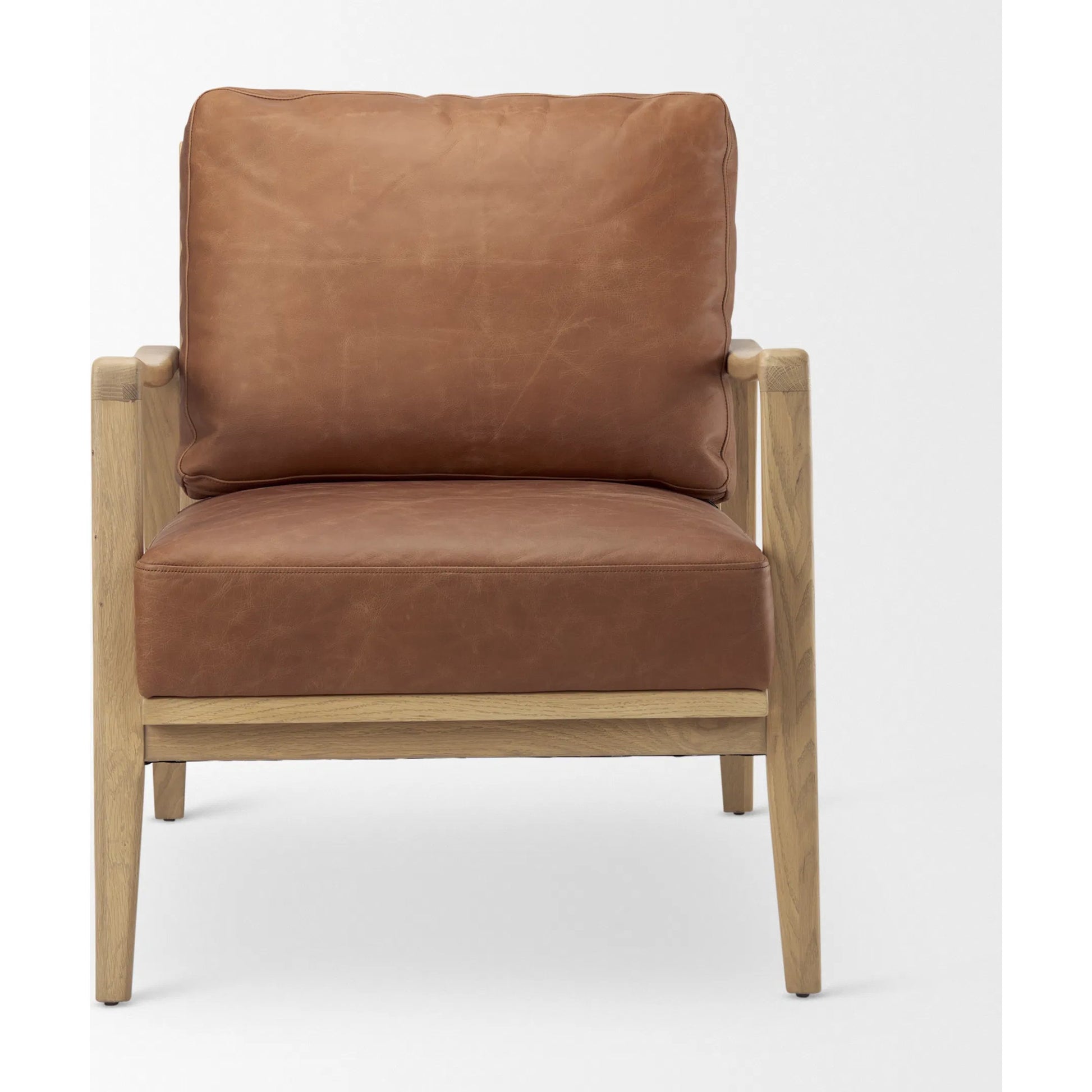 Raeleigh Leather Accent Chair by Mercana in tan. Made from fabric in a traditional style.