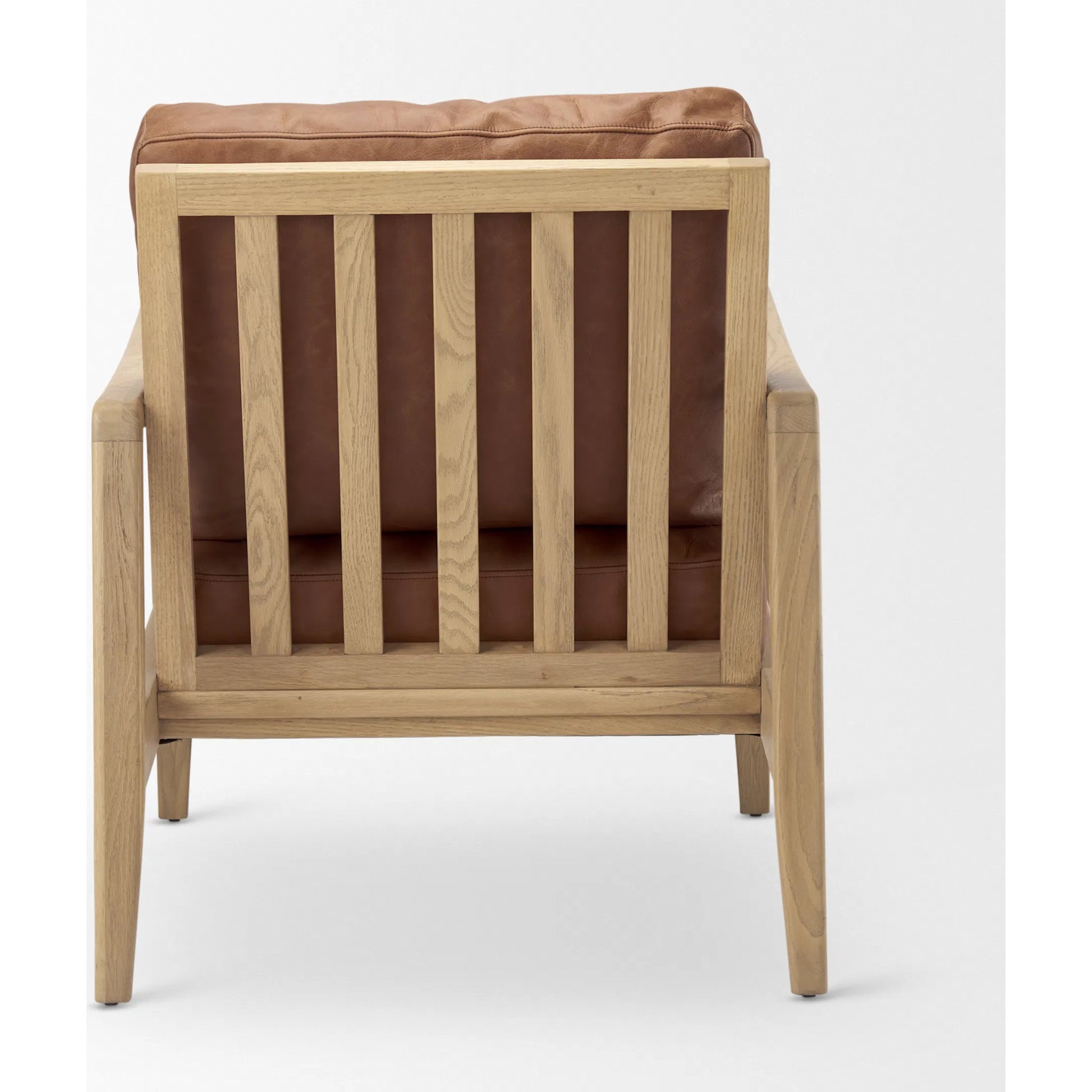 Raeleigh Leather Accent Chair by Mercana in tan. Made from fabric in a traditional style.