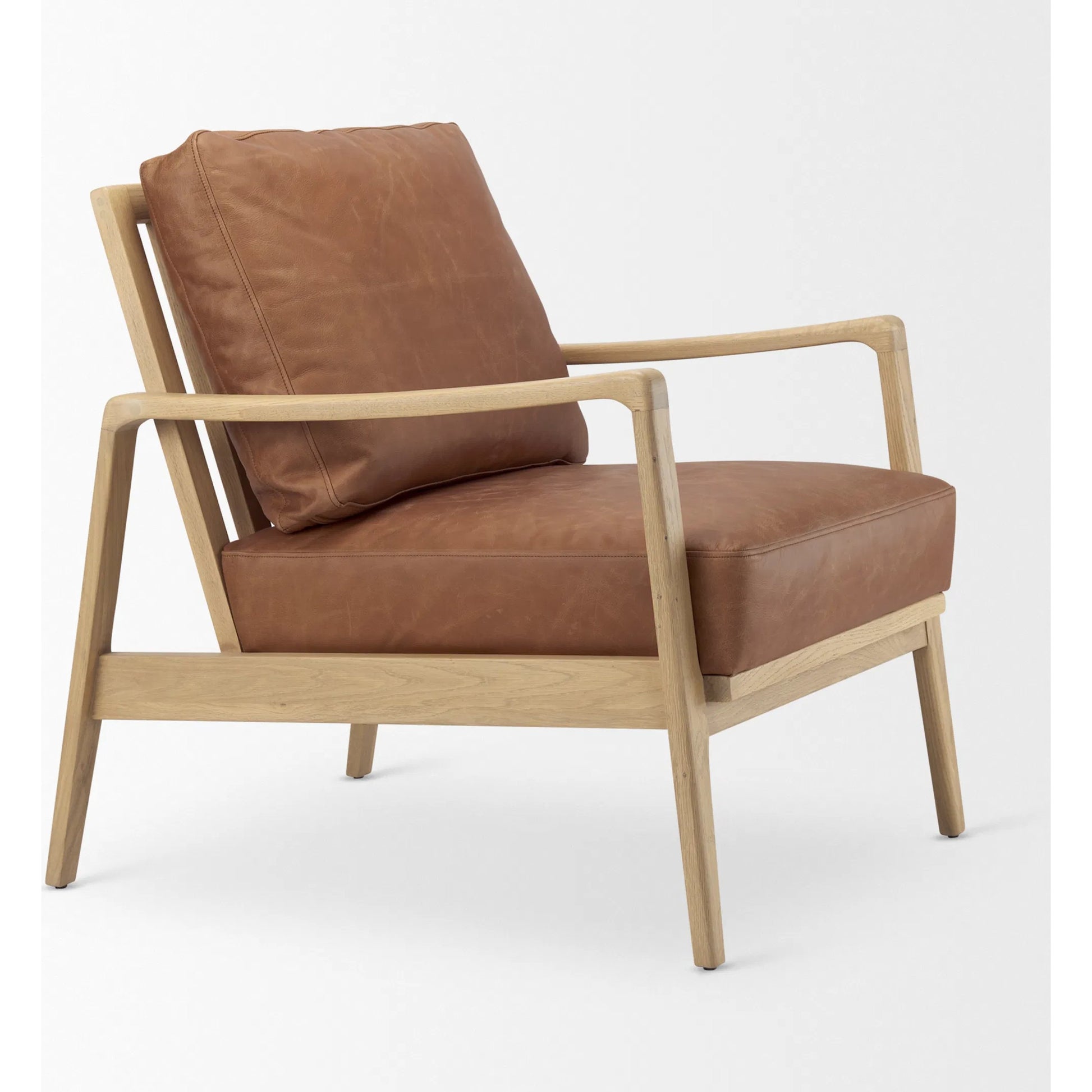 Raeleigh Leather Accent Chair by Mercana in tan. Made from fabric in a traditional style.