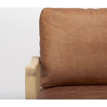 Raeleigh Leather Accent Chair by Mercana in tan. Made from fabric in a traditional style.