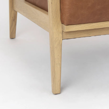 Raeleigh Leather Accent Chair by Mercana in tan. Made from fabric in a traditional style.