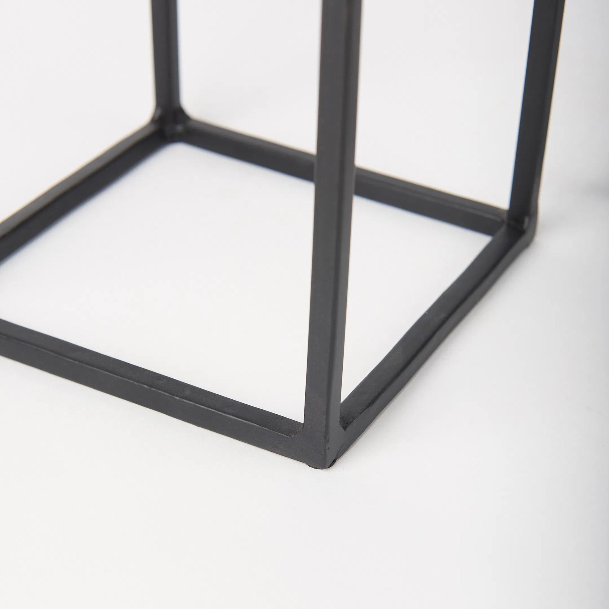 Cindy Candle Holders by Mercana in black. Made from metal in a transitional style.