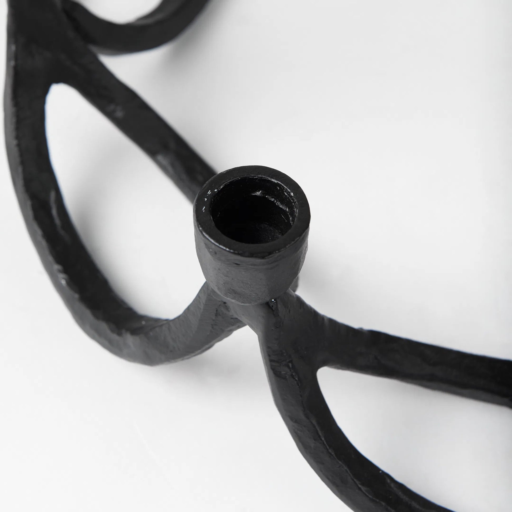 Seraph Candle Holder by Mercana in black. Made from metal in a traditional style.