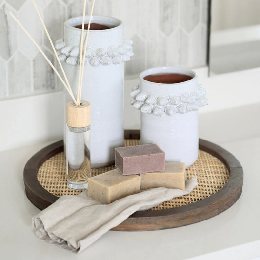 Silas Round Tray by Mercana in brown. Made from wicker in a rustic style.