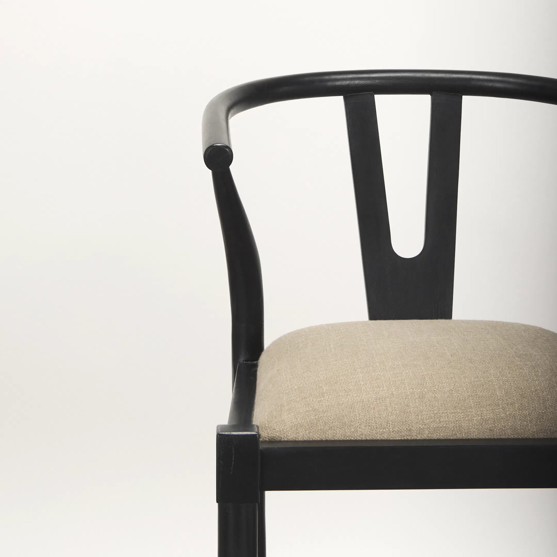 Trixie Upholstered Seat Bar Stool by Mercana in black. Made from solid wood in a unique style.
