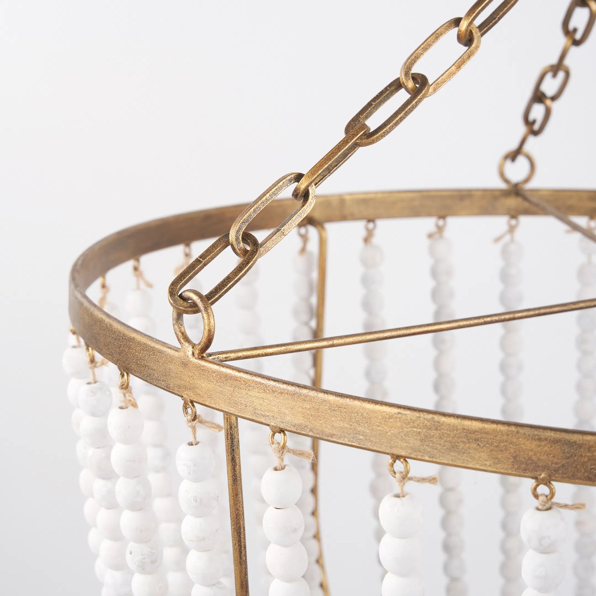 Rhone Chandelier by Mercana in gold. Made from metal, wood in a traditional style.