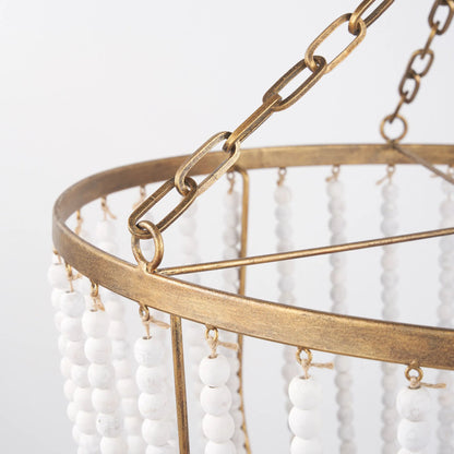Rhone Chandelier by Mercana in gold. Made from metal, wood in a traditional style.
