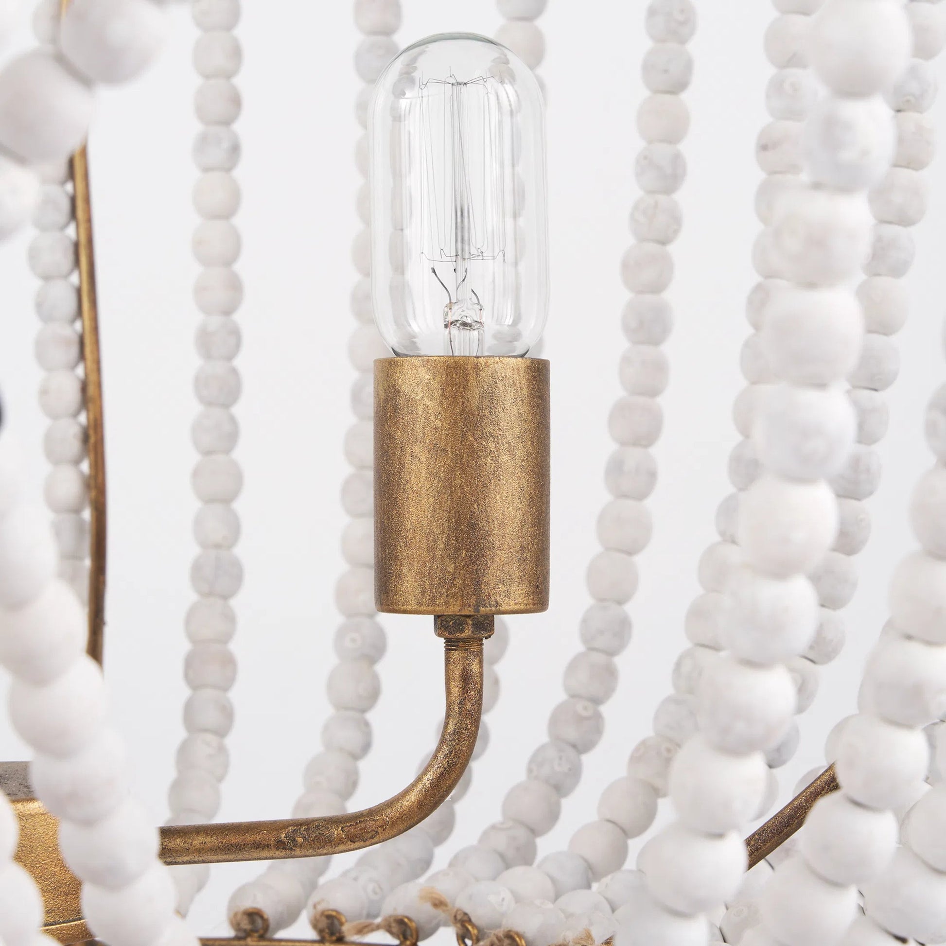 Rhone Chandelier by Mercana in gold. Made from metal, wood in a traditional style.