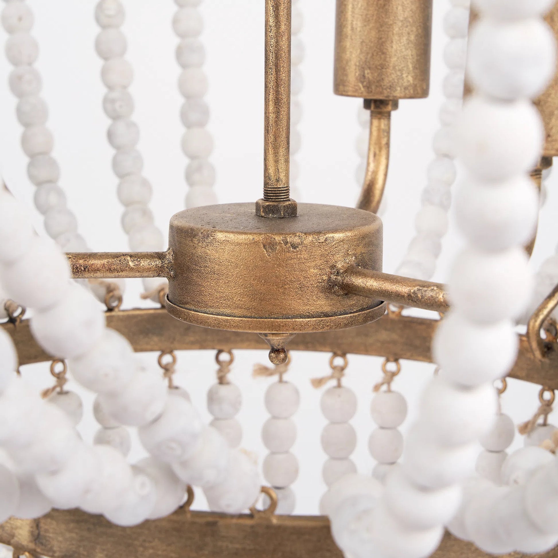 Rhone Chandelier by Mercana in gold. Made from metal, wood in a traditional style.