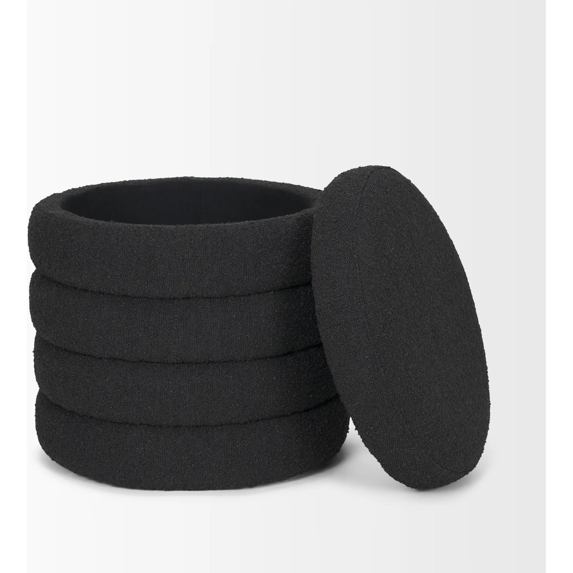 Elise Ottoman by Mercana in black. Made from fabric in a unique style.
