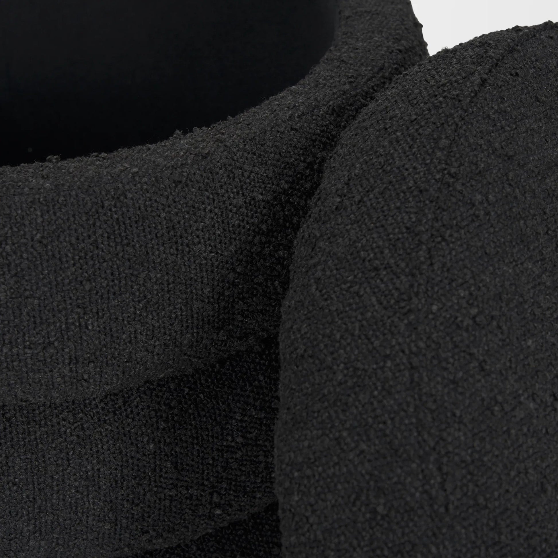 Elise Ottoman by Mercana in black. Made from fabric in a unique style.