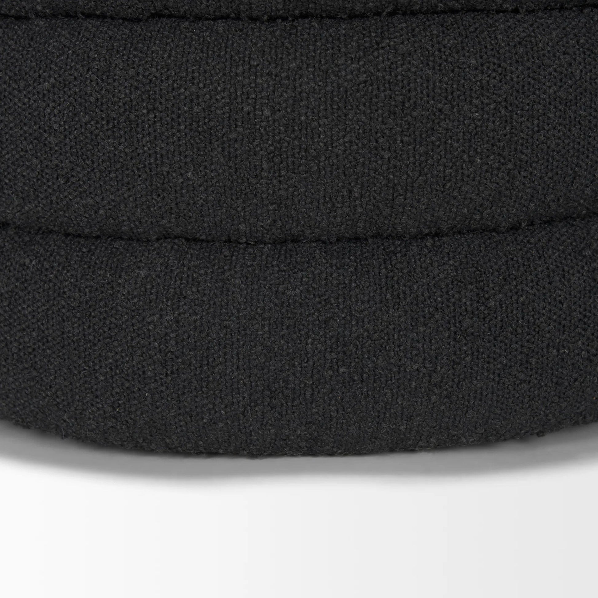 Elise Ottoman by Mercana in black. Made from fabric in a unique style.