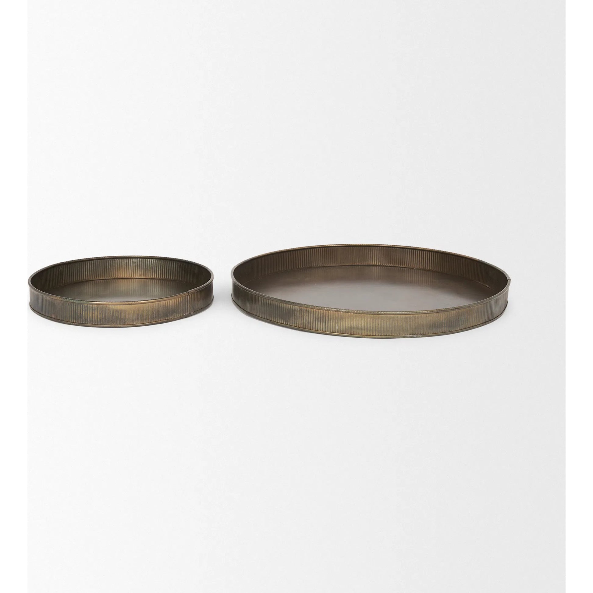 Varun Round Antiqued Brass Trays by Mercana in yellow. Made from metal in a modern style.