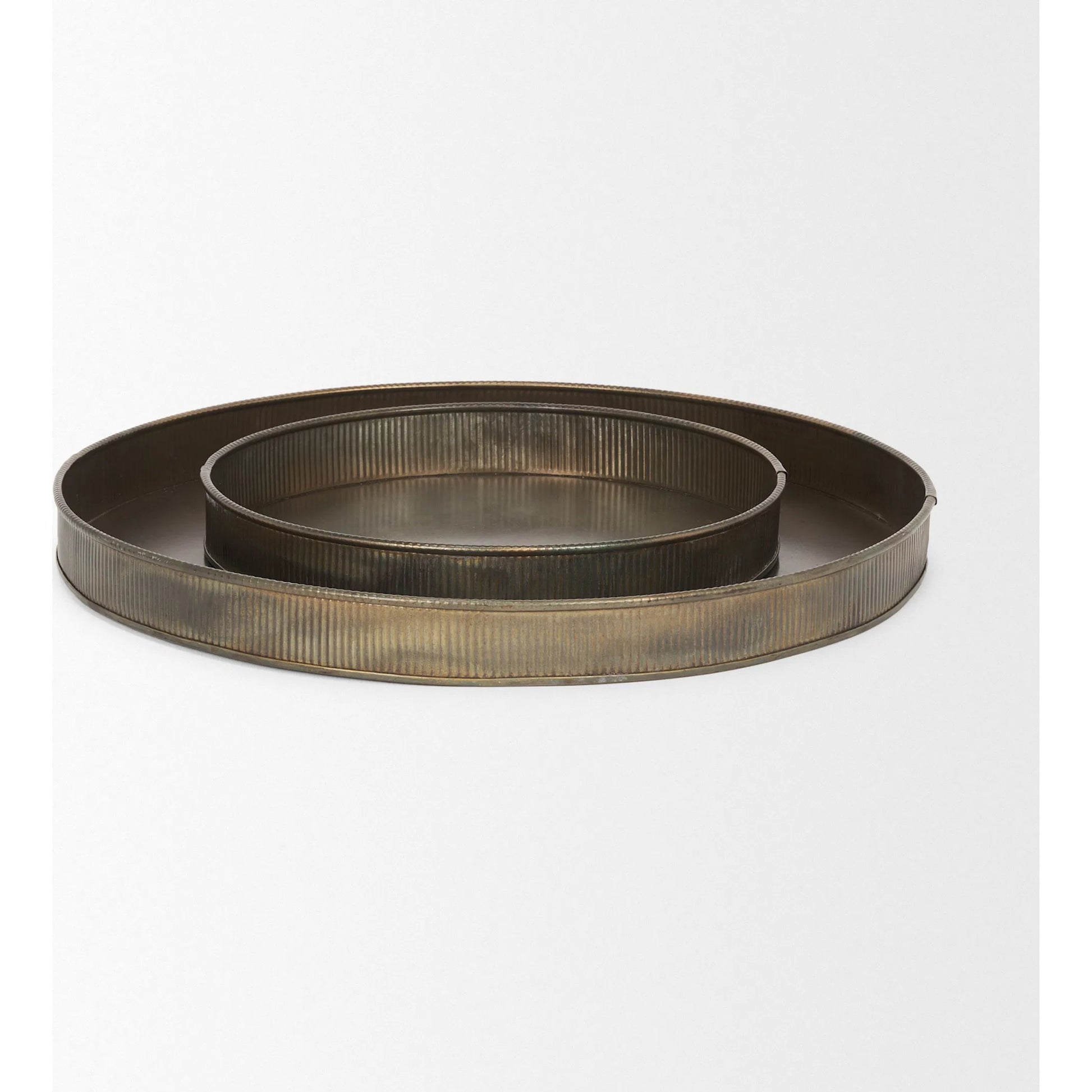 Varun Round Antiqued Brass Trays by Mercana in yellow. Made from metal in a modern style.