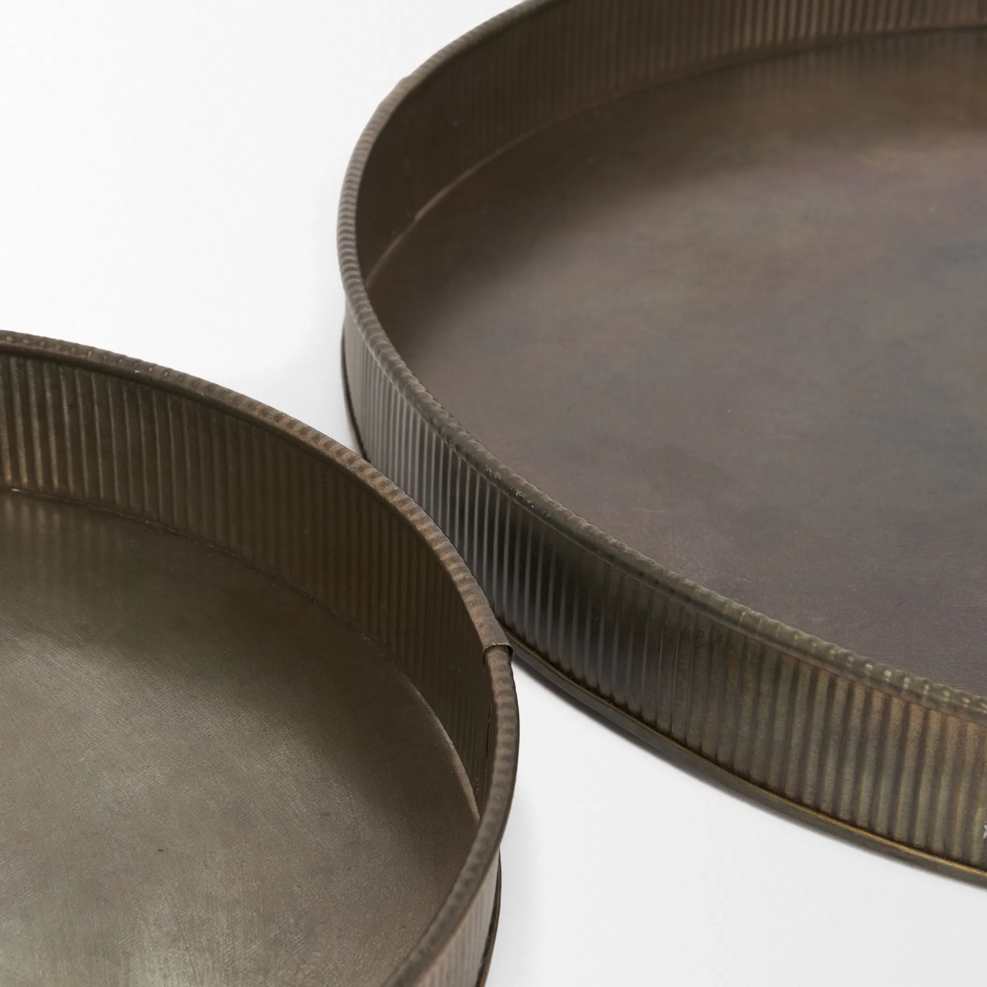 Varun Round Antiqued Brass Trays by Mercana in yellow. Made from metal in a modern style.