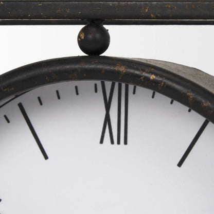 Raisa Table Clock by Mercana in black. Made from metal in a traditional style.